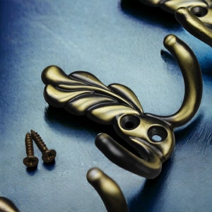 Messing muurhaken, antieke kapstokken, klimop metalen bronzen sleutelhanger, sterke antieke handdoekbeugel, badkamerhanddoekrots en entreemuurhaken