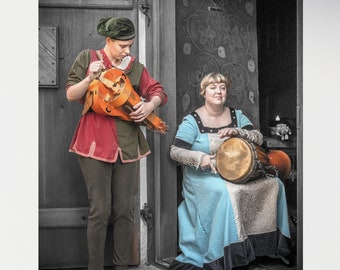 Women in Medieval Costume Playing Hurdy gurdy and Drum