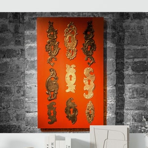 Antique Old Door Metal Keyhole Decorations on Orange Plaque Brick Wall