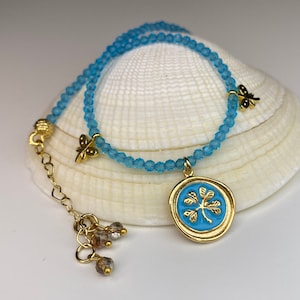 Turquoise-colored crystal stone and cloverleaf love and luck anklet