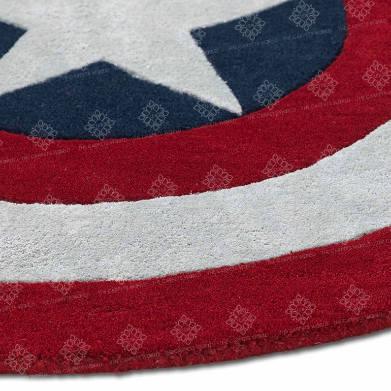 May include: A red, white, and blue circular rug with a large white star in the center. The rug is made of a soft, plush material and has a subtle texture.