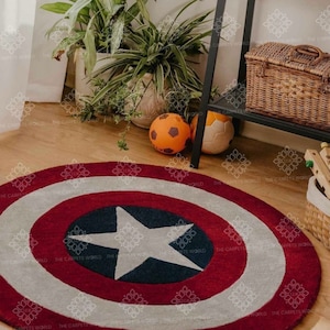 May include: A round, red, white, and blue rug with a large white star in the center. The rug is designed to look like Captain America's shield.