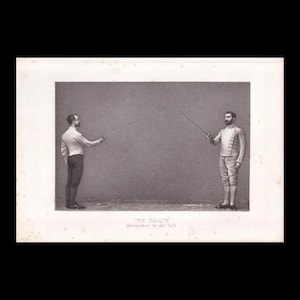 May include: A black and white vintage print showing two fencers in uniform holding foils, titled THE SALUTE Recognition to the left. The fencers stand in profile, wearing jackets and breeches, with their blades extended in a formal fencing salute.
