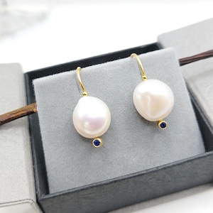 Freshwater pearl wire earrings made of 14K yellow gold&blue round zircons on their bottom.Hand-made 14k gold white pearl earrings for women