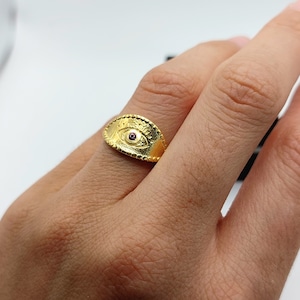 Evil eye Protection ring.  Evil Eye ring made of yellow gold plated silver and a red zircon in the middle. Protection Greek Mati ring.