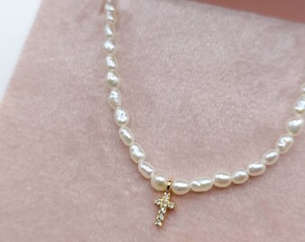 Diamond cross pearl necklace. Diamond cross made of 18k yellow gold set on a freshwater pearl necklace. Special Gift for her.