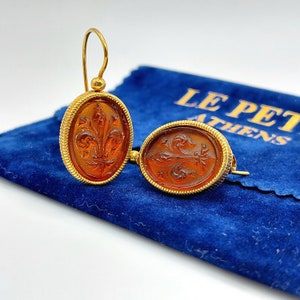 Intaglio printing glass oval shaped earrings made of yellow gold plated silver 925o and orange crystal glass print.Orange intaglio earrings