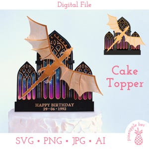 May include: A dragon cake topper with a gold dragon silhouette and wings, set against a black gothic arch design with a colorful galaxy background. The text "Happy Birthday 29.06.1992" is displayed on the base. The words "Cake Topper" are also visible.