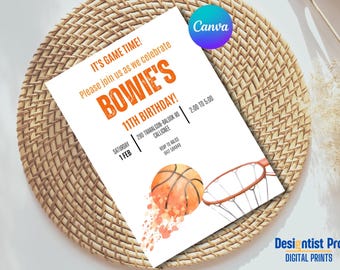 May include: A white basketball-themed birthday invitation with orange text. The invitation says "It's Game Time!" and "Please join us as we celebrate Bowie's 11th Birthday!" The invitation includes a watercolor illustration of a basketball going through a hoop.