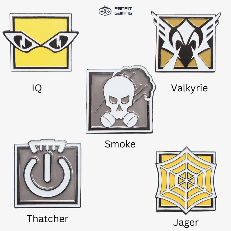 May include: Set of 6 Rainbow Six Siege enamel pins featuring the operators IQ, Valkyrie, Smoke, Thatcher, Jager, and a FanFit Gaming logo.