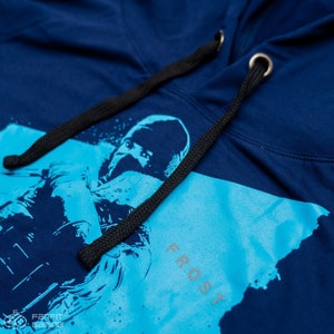 May include: A navy blue hoodie with a black drawstring. The hoodie features a blue and white graphic of a person with the word "FROST" printed on the front.