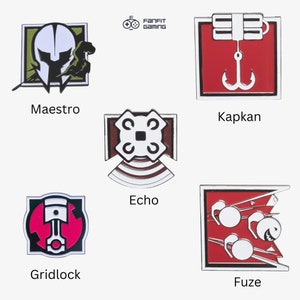May include: Set of 6 Rainbow Six Siege operator enamel pins. The pins feature the operators Maestro, Kapkan, Echo, Gridlock, Fuze, and a FanFit Gaming logo.