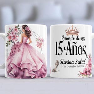 May include: White ceramic mug with a pink floral design and a crown on the front. The mug says "Recuerdo de mis 15 Años Karina Salas 14 de Diciembre del 2024".