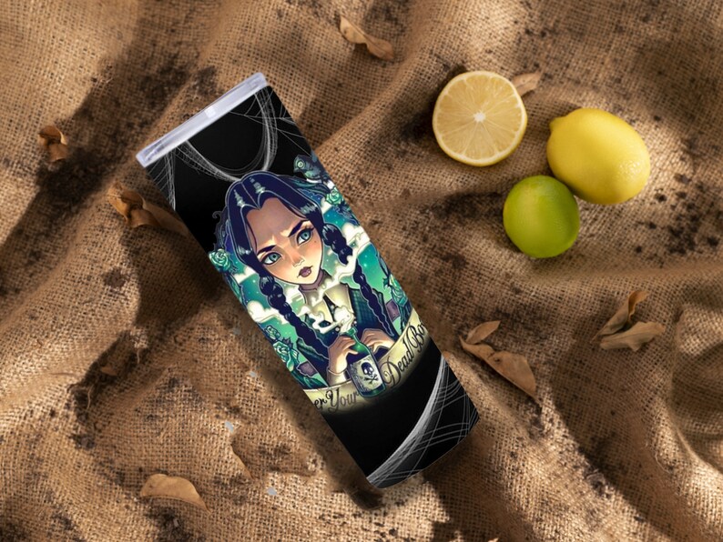 May include: A black and green stainless steel tumbler with a graphic of a girl with long black hair and a green dress holding a bottle that says "Never Your Dead Boy".