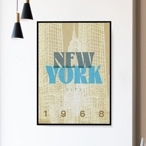 New York retro travel poster shows artwork of Empire State Building. Available as a digital download.