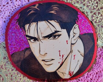 May include: A wood slice featuring a detailed illustration of a manga-style male character with dark hair and blood splatters on his face. The artwork is framed with a red border and set against a pink glitter background.
