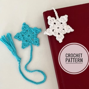 May include: Two handmade crochet star bookmarks. One is turquoise with a tassel, the other is white. The bookmarks are next to a red book with a "CROCHET PATTERN" graphic.