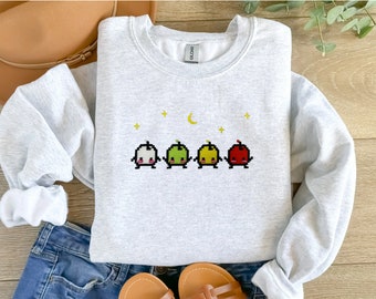 Sudadera bordada Junimo de Stardew Valley, cuello redondo suave y estética gamer, top acogedor de juego indie, bonito regalo unisex de pixel art para ella y él.