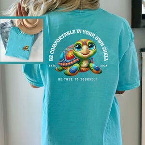 Sea Turtle Beach T-shirt Positive Message YW Summertime Beachwear Be Comfortable In Your Own Shell Inspirational Colorful Vacay Gift Tee Lagoon Blue