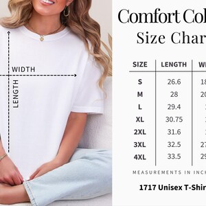 May include: White Comfort Colors 1717 Unisex T-Shirt with a size chart. The chart shows measurements in inches for sizes S through 4XL. The length of the shirt ranges from 67.6 to 85.1 cm, and the width ranges from 46.4 to 75.6 cm.