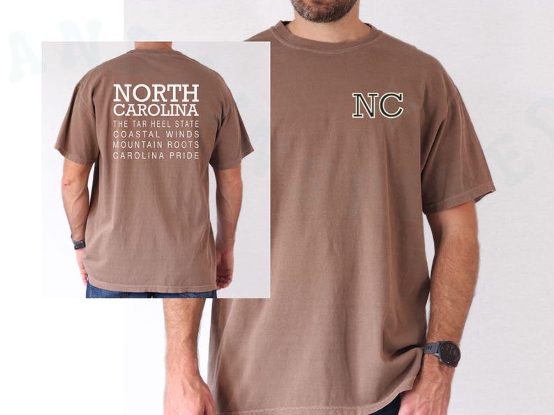 May include: A brown t-shirt with the text "NORTH CAROLINA" on the back, including phrases like "The Tar Heel State" and "Carolina Pride." The front displays the letters "NC" in a green and white outline.