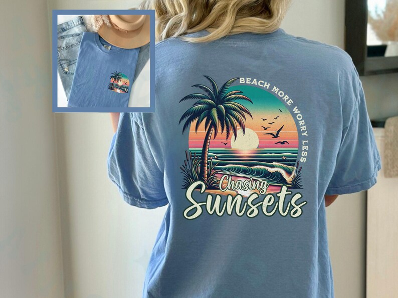 May include: Light blue t-shirt with a graphic of a palm tree, sunset, and ocean waves. The text "Beach More Worry Less" is printed in a circle around the graphic. The text "Chasing Sunsets" is printed below the graphic.