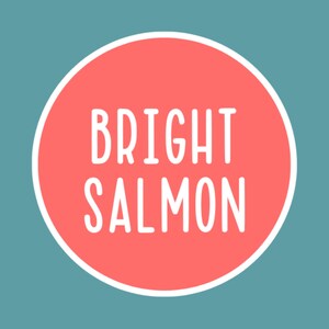 May include: A round graphic with the words "BRIGHT SALMON" in white, set against a coral-colored circle with a white border. The background is a teal color.
