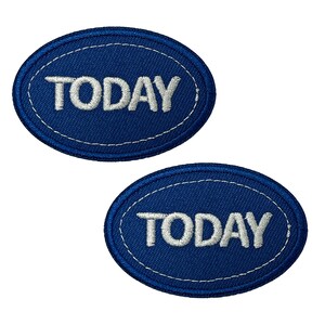 May include: Two dark blue oval patches, each embroidered with the word "TODAY" in white. A white stitched border surrounds each patch. These patches could be used to decorate clothing or accessories.