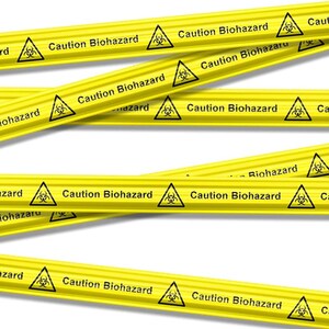 May include: Yellow hazard tape featuring the text "Caution Biohazard" and a biohazard symbol. The tape is arranged diagonally against a white backdrop, forming a warning pattern.