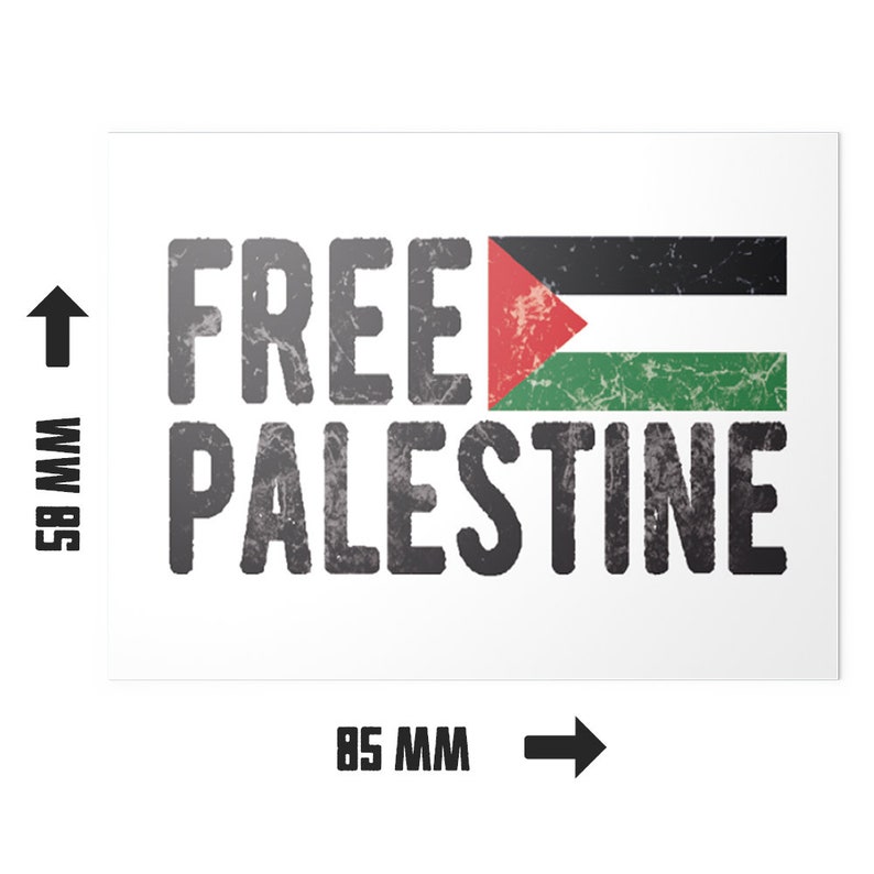 May include: A white rectangular sticker with the words "FREE PALESTINE" in distressed gray font. The Palestinian flag is displayed on the right. The sticker measures 85 mm wide and 58 mm high.
