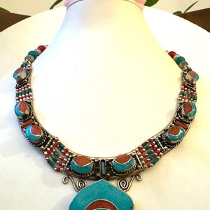 Stunning Handcrafted tribal theme Pendant necklace inlay with Turquoise and coral stone set in Tibetan silver  19”inch long & 126grams.