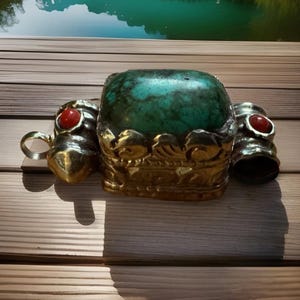 Vintage and beautiful hand carved auspicious floral pattern Tibetan green turquoise pendant set in Tibetan silver 1.5”inch tall & 10 grams.