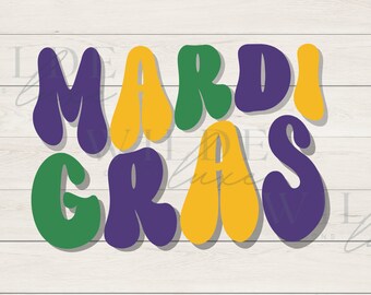 May include: A colorful Mardi Gras design with the words "MARDI GRAS" in large, bubble letters. The letters are in purple, green, and yellow, with a white shadow effect. The background is a light wood grain.