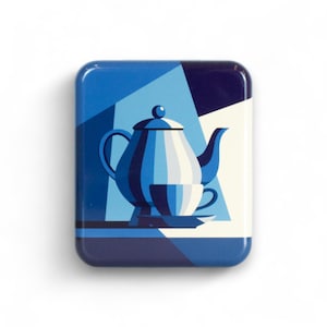 May include: A square, blue decorative tin featuring a geometric illustration of a teapot and teacup. The teapot is white and blue, with a matching teacup and saucer. The background has a geometric design in shades of blue and white.