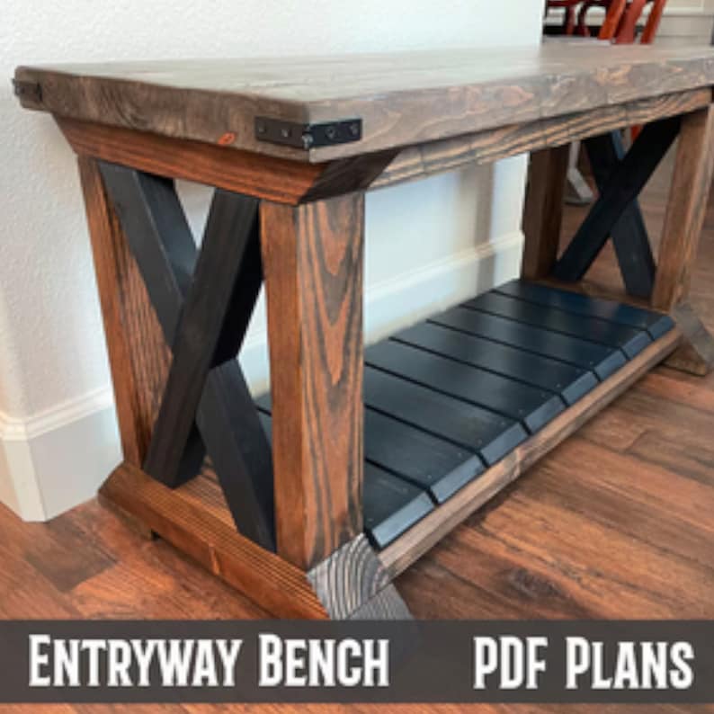 May include: A wooden entryway bench with a black stained shelf and black X-shaped supports. The bench has a dark wood finish and metal accents.