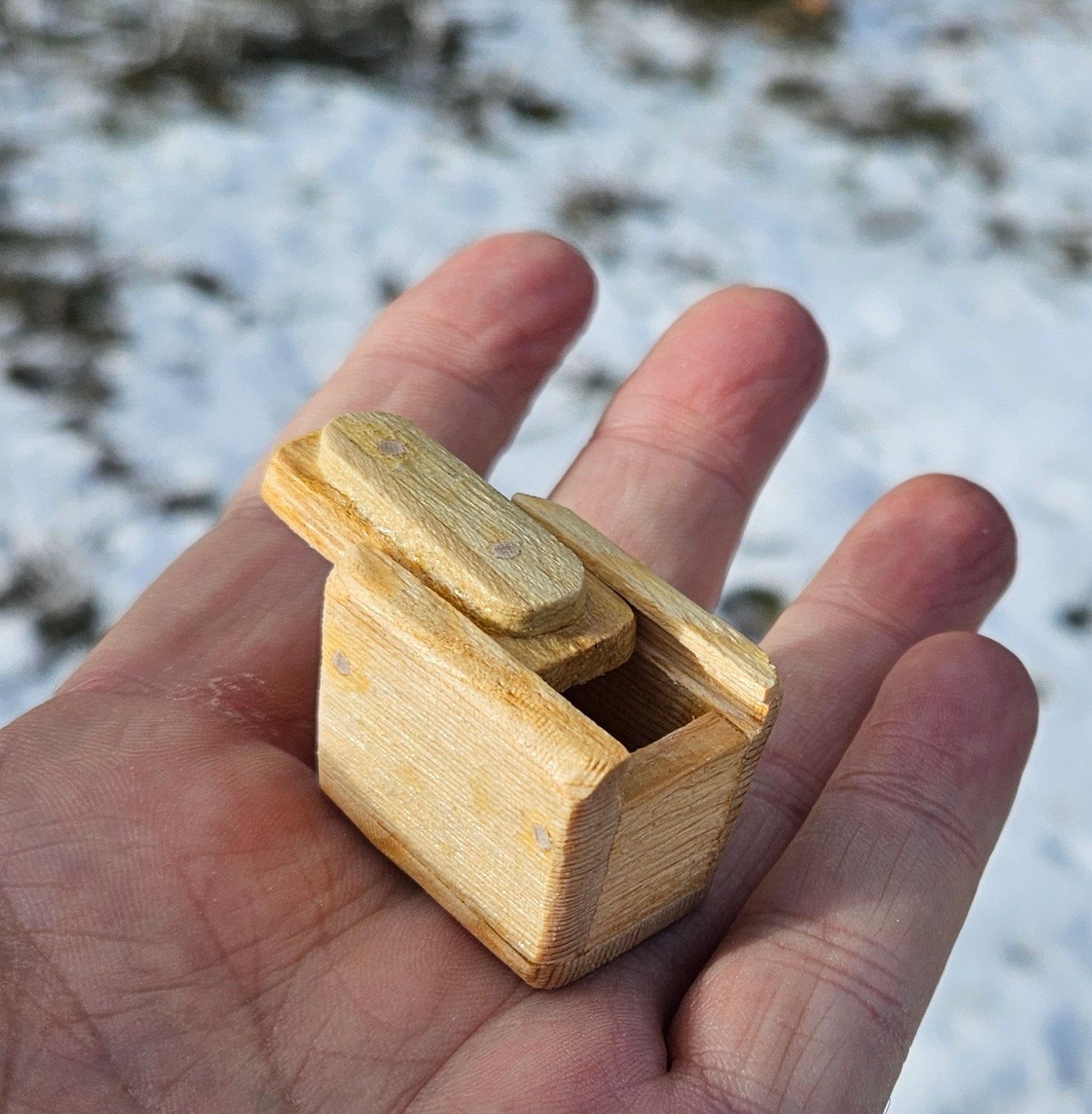 Tiny, pocket sized wooden boxes with sliding tops. Each one is absolutely unique.