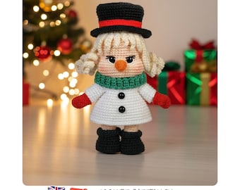 May include: A crocheted snowman doll with blonde hair, wearing a black top hat with a red band, a green scarf, a white coat with two black buttons, red mittens, and black boots. The doll has a carrot-shaped nose and rosy cheeks.