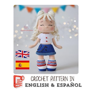 May include: A handmade crochet doll with a white top, blue skirt, and red, white, and blue striped boots. The doll has blonde hair styled in two buns. The image includes the text "CROCHET PATTERN IN ENGLISH & ESPAÑOL".