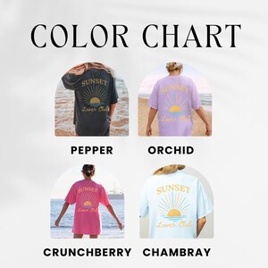 May include: Color chart showing four different colors of a t-shirt with a sunset graphic and the text "Sunset Lover Club". The colors are pepper, orchid, crunchberry, and Chambray.