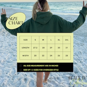 May include: Size chart for a green hoodie with measurements in inches. The chart shows the length and width of the hoodie in inches for sizes S, M, L, XL, and 2XL. The text "ALL SIZE MEASUREMENT ARE IN INCHES" and "SIZE UP 1-3 SIZES FOR OVERSIZED STYLE" is also included. The text "BLACK IVY Collection" is at the bottom of the chart.