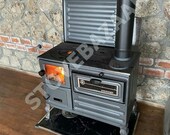 Stove with cast iron fireplace. Cast iron stove with oven. Fire pit, Wood stove, Coal stove, Cabin.