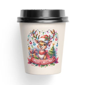 May include: A white paper coffee cup with a black lid features a cartoon reindeer wearing a Santa hat and holding a gift. The reindeer is surrounded by Christmas lights and a small Christmas tree. The cup has the text "Merry Christmas" on a red ribbon.