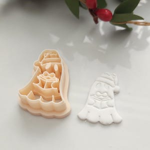 Christmas Ghost polymer clay cutter holding a gift embossed craft tool for handmade earring making polymer clay earrings Ghost Santa hat