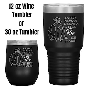 May include: Two black stainless steel tumblers with a white outline of a person wearing a cowboy hat and the text "Every woman needs a little Rip in her jeans". The tumbler on the left is 12 ounces and the tumbler on the right is 30 ounces.
