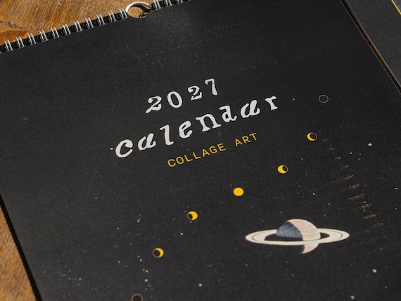2027 Wall Calendar Surreal Art Space Theme Celestial Imagery Moon Planets Vintage Collage Black Background Gold Border Spiral Bound Monthly