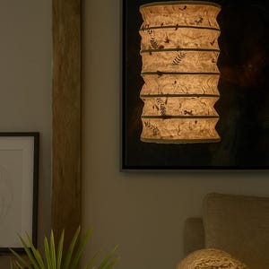 Handmade Lokta paper Classic Pendant lamp shade with bamboo frame – eco-friendly Japanese-style lighting. Hanging Lokta paper pendant lamp – sustainable minimalist decor. Neutral tone paper pendant light – perfect for Japandi and zen-inspired interiors. Set of handmade paper lamp shades in assorted sizes – minimalist home decor. Lokta Paper Lamp Shade with Bamboo Frame. Minimalist Design. Embossed Petals, Leaves. Perfect for Home Décor. Unique Shapes: Cylindrical, Abstract, Globe.