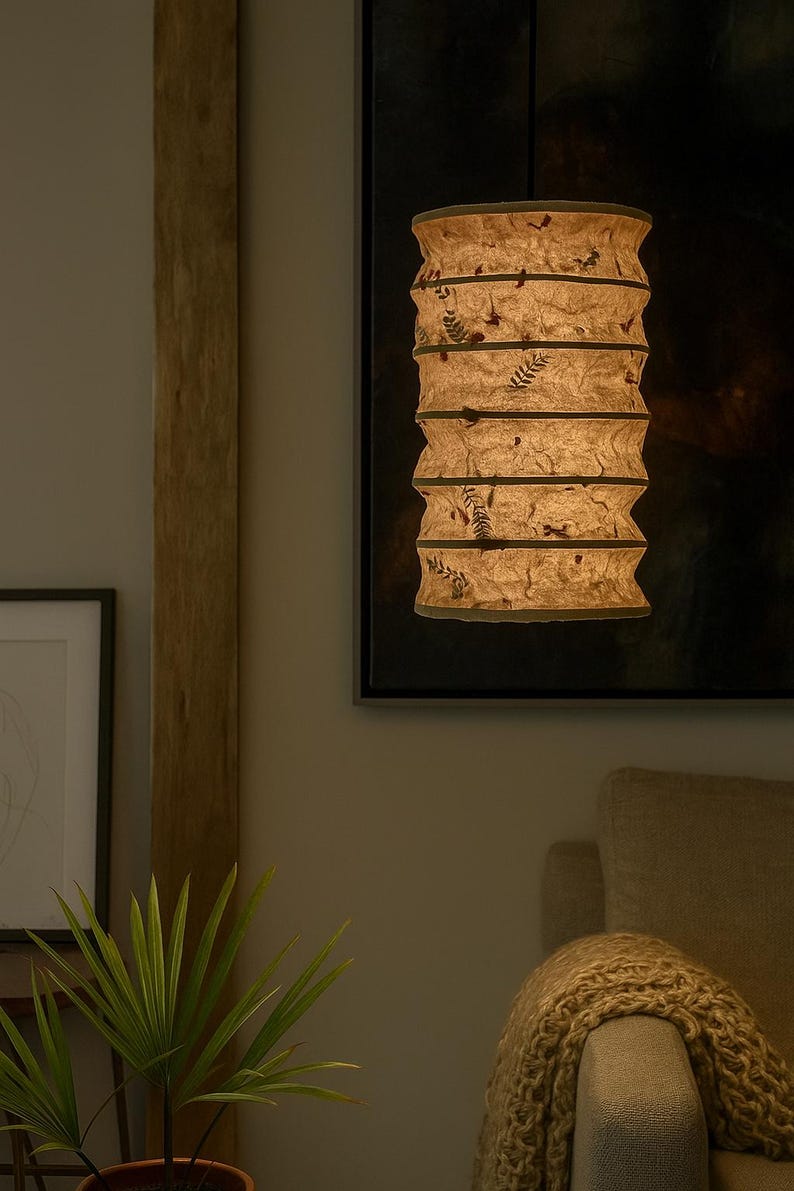 Handmade Lokta paper Classic Pendant lamp shade with bamboo frame – eco-friendly Japanese-style lighting. Hanging Lokta paper pendant lamp – sustainable minimalist decor. Neutral tone paper pendant light – perfect for Japandi and zen-inspired interiors. Set of handmade paper lamp shades in assorted sizes – minimalist home decor. Lokta Paper Lamp Shade with Bamboo Frame. Minimalist Design. Embossed Petals, Leaves. Perfect for Home Décor. Unique Shapes: Cylindrical, Abstract, Globe.