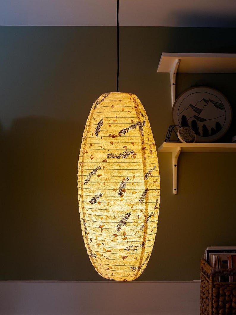 Handmade Lokta paper lamp shade with bamboo frame – eco-friendly Japanese-style lighting. Cylindric Pendant in Large variation paper lantern – Asian-inspired handcrafted light. Hanging Handmade Nepalese Lokta Paper Lamp Shade with Bamboo Frame - Sustainable, Durable, Lightweight. Minimalist Asian-Inspired Design. Embossed Petals, Leaves. Perfect for Home Décor. Unique Shapes: Cylindrical, Abstract, Accordion Hexagon, Globe.