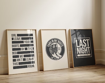 May include: Three framed prints with black and white text and graphics. The first print says "Girl leave your boots by the bed we ain't leavin' this room." The second print says "Sand in my boots" with a graphic of a cowboy boot. The third print says "Last night we let the liquor talk."