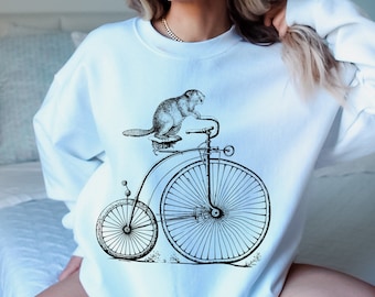 Castor en una sudadera de bicicleta, Dam It Beaver, suéter de castor divertido, jersey de animales divertido, amante del castor, suéter unisex, sudaderas novedosas